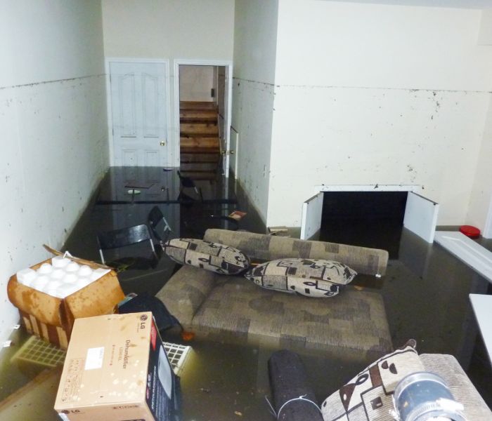 A flooded home needing water damage restoration in Concord.